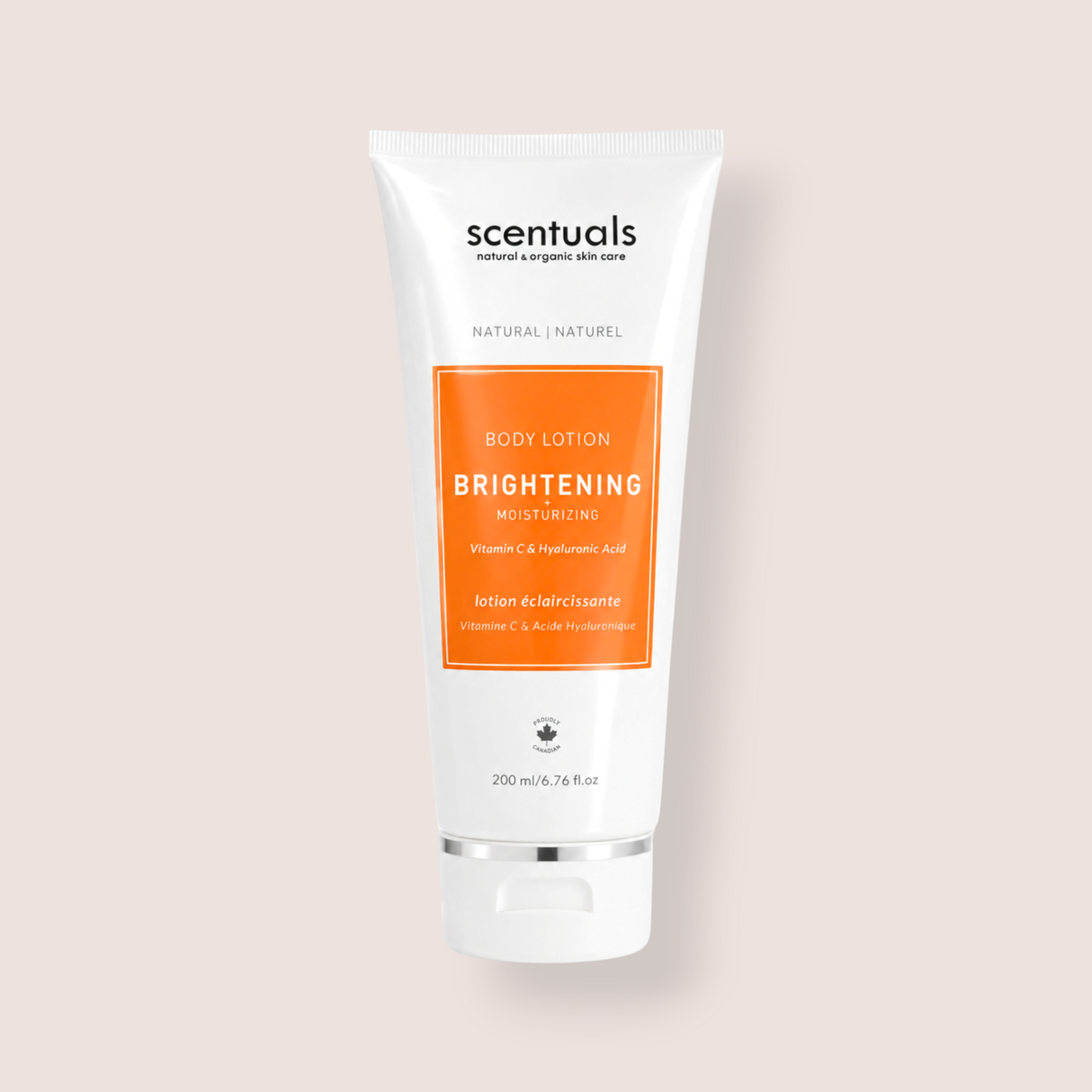 A 200 ml white squeeze tube of Scentuals Brightening Moisturizing Body Lotion, featuring a prominent orange label on the front, set against a solid pale beige background.