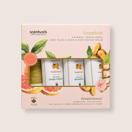 Scentuals Grapefruit & Pampomousse gift set containing a shampoo, conditioner, body wash, and hand & body repair cream in a light pink box with citrus illustrations.