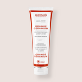 A 250ml squeeze tube of scentuals Orange Geranium Moisturizing Hand & Body Lotion, featuring a white tube with bold red and black text, set against a solid light beige background.